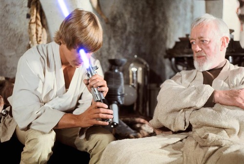 Obi-Wan instantly regretting his decision to give a laser sword to a farm boy who looks at it like a telescope.
